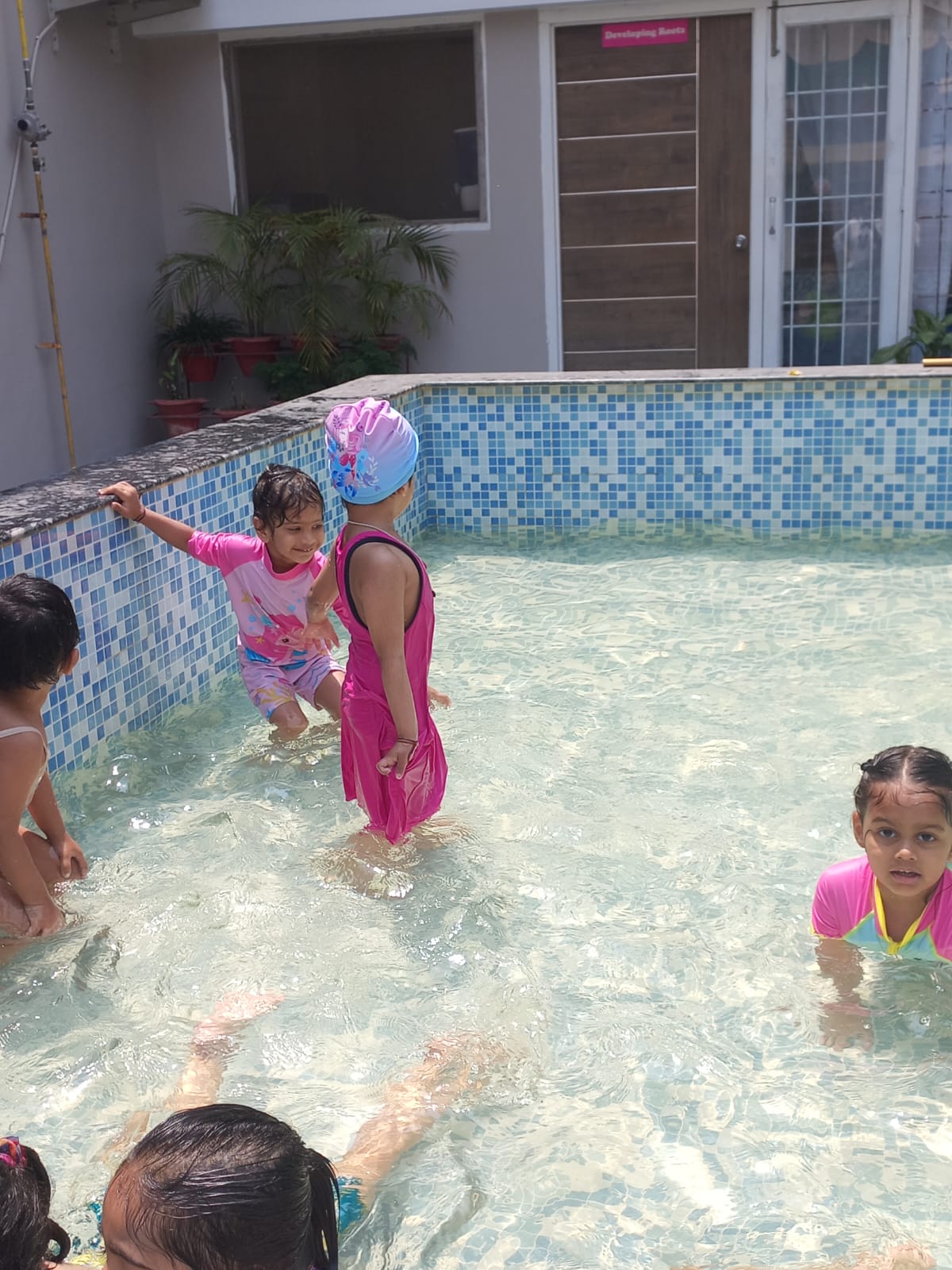 Preschoolers enjoying the indoor soft play area with slides at Edujoy